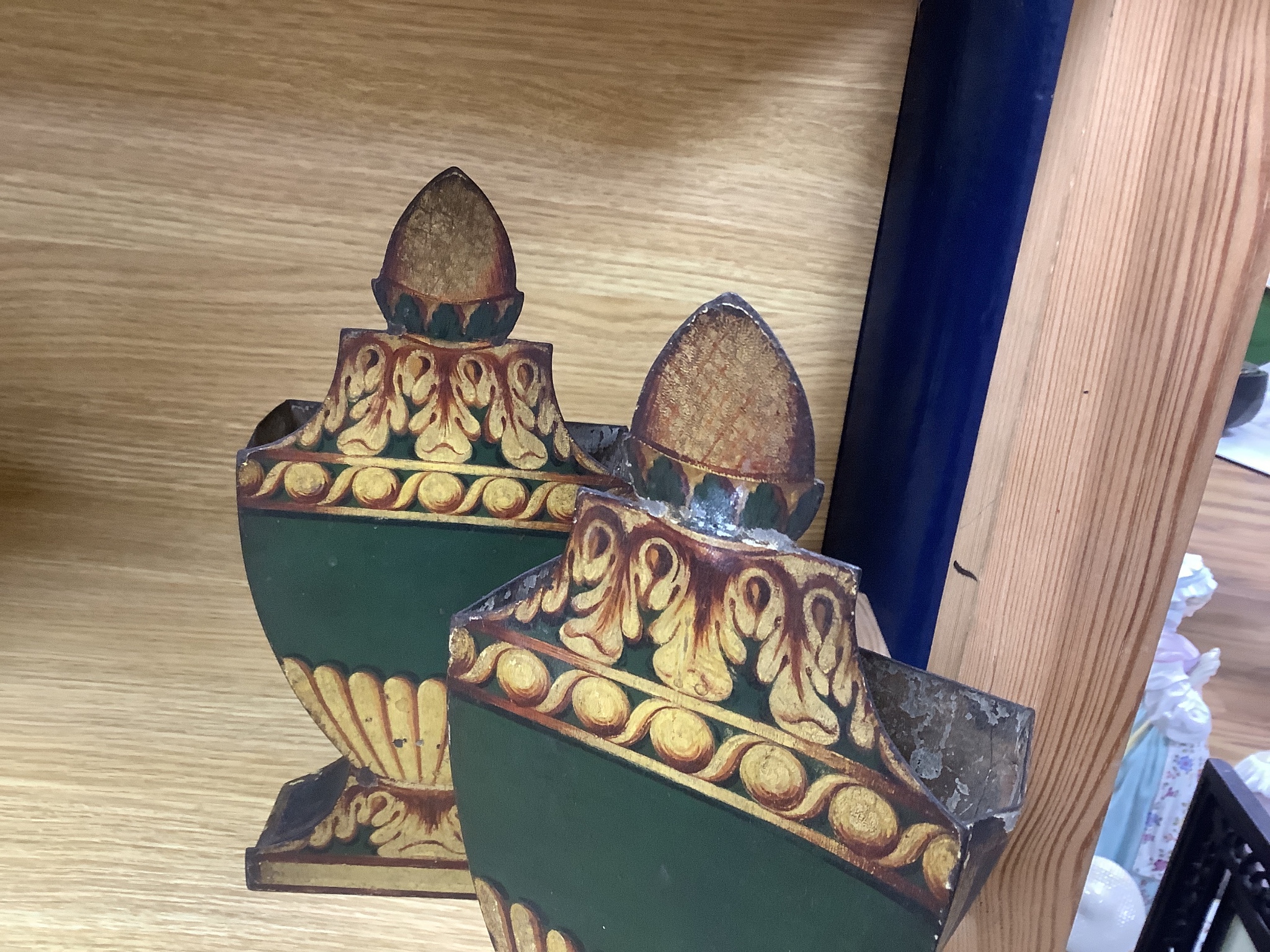 A pair of 19th century French painted urn-shaped toleware spill vases, 23.5cms high